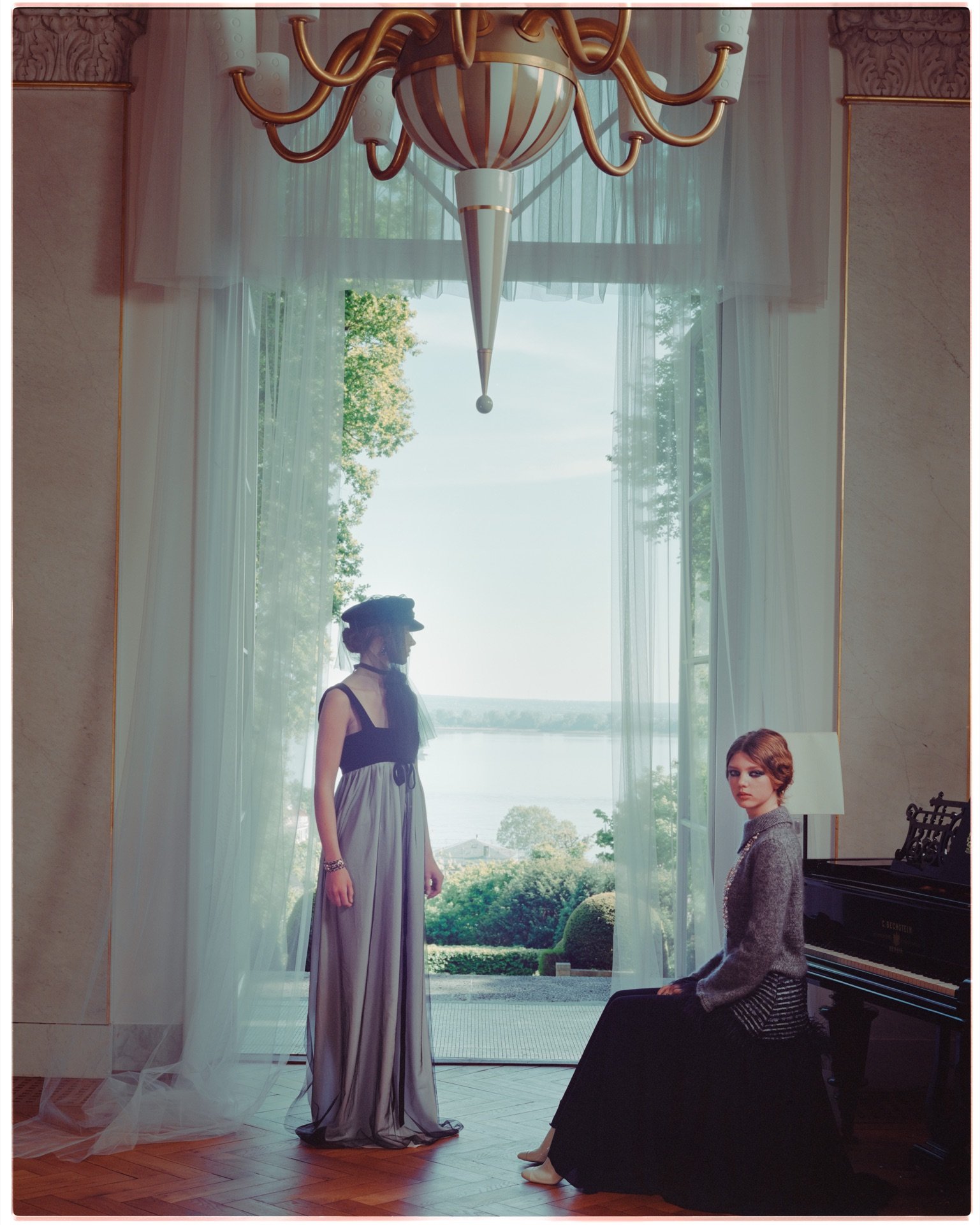 A model in a doorway of Villa Jako looking out at the Elbe