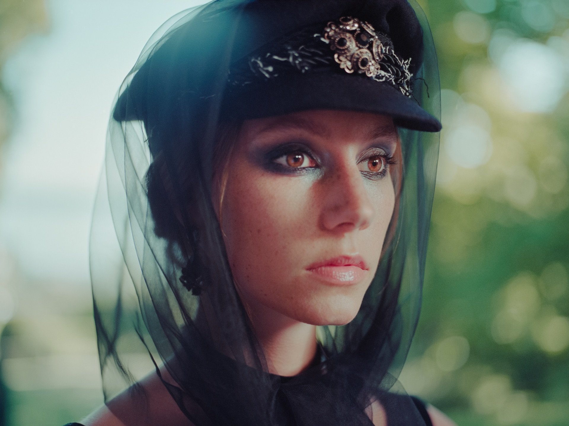 A portrait of a woman beneath a veil