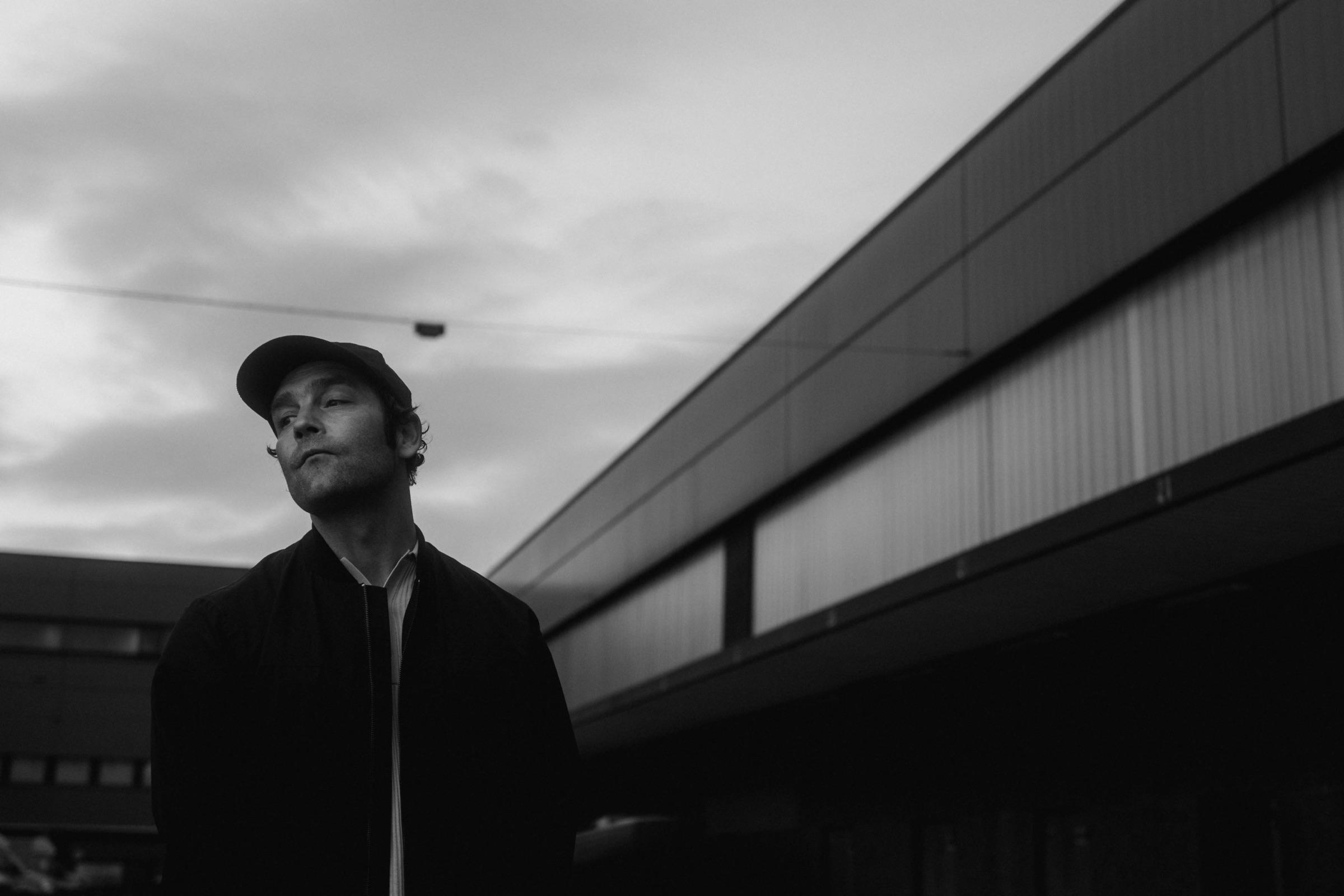 Black and white portrait of Bosse against the sky